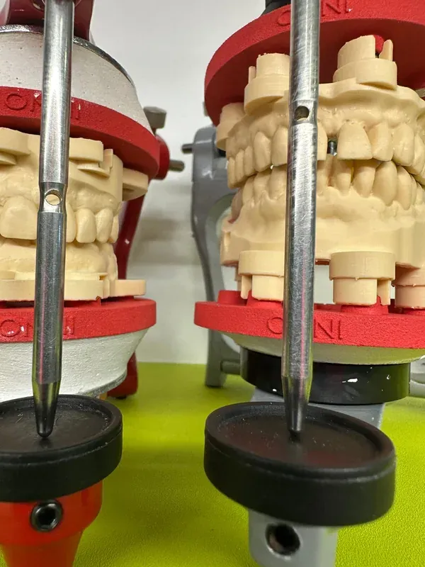Two ASA Dental articulators with red DACOS Omni plates